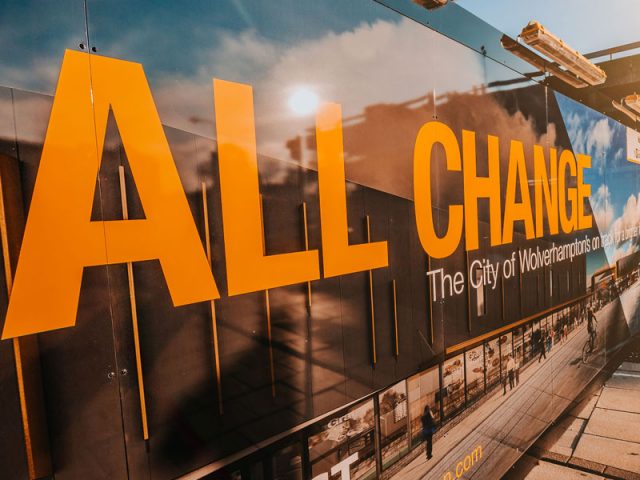 Hoarding messaging in Wolverhampton, reading: "All change, The city of Wolverhamption's on track".