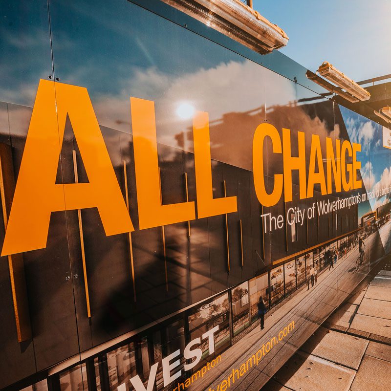 Hoarding messaging in Wolverhampton, reading: "All change, The city of Wolverhamption's on track".