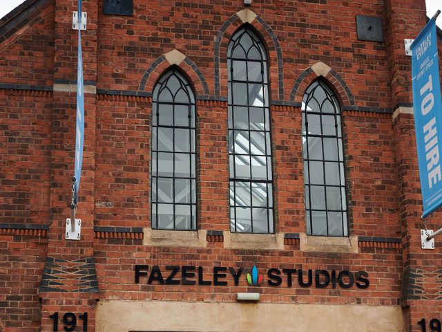 Fazeley Studios logo on old-style building. Banners above the entrance advertise unique event space to hire.