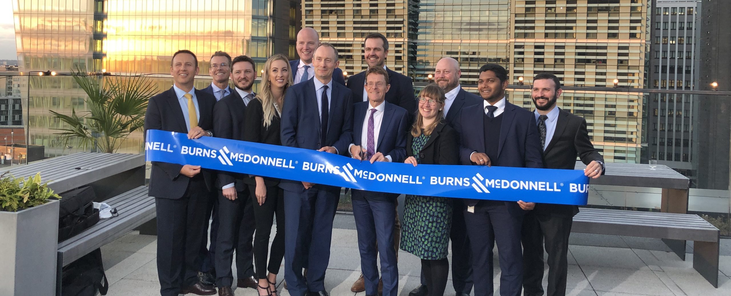 Burns & McDonnell cutting the ribbon outside their new offices.