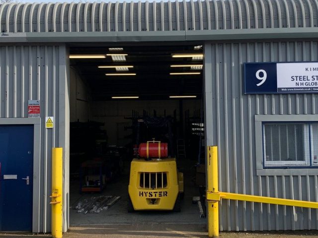 Warehouse door with a fork lift inside.