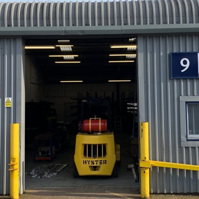Warehouse door with a fork lift inside.