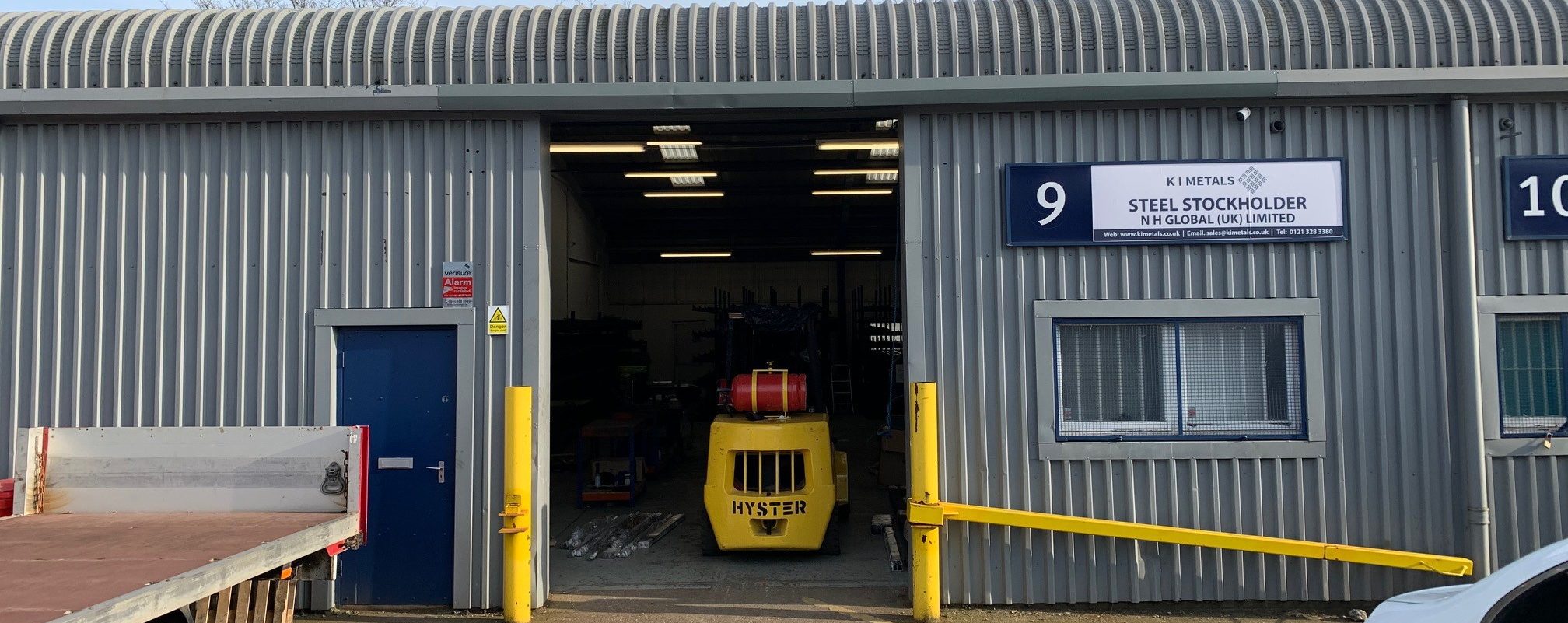 Warehouse door with a fork lift inside.