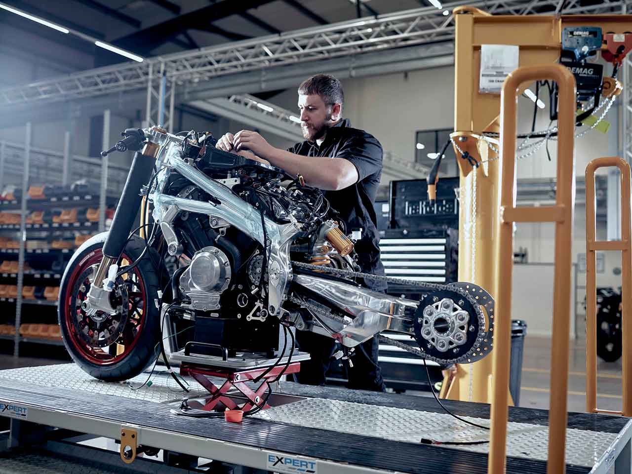 Norton Motor cycles employee working on a motorcycle.