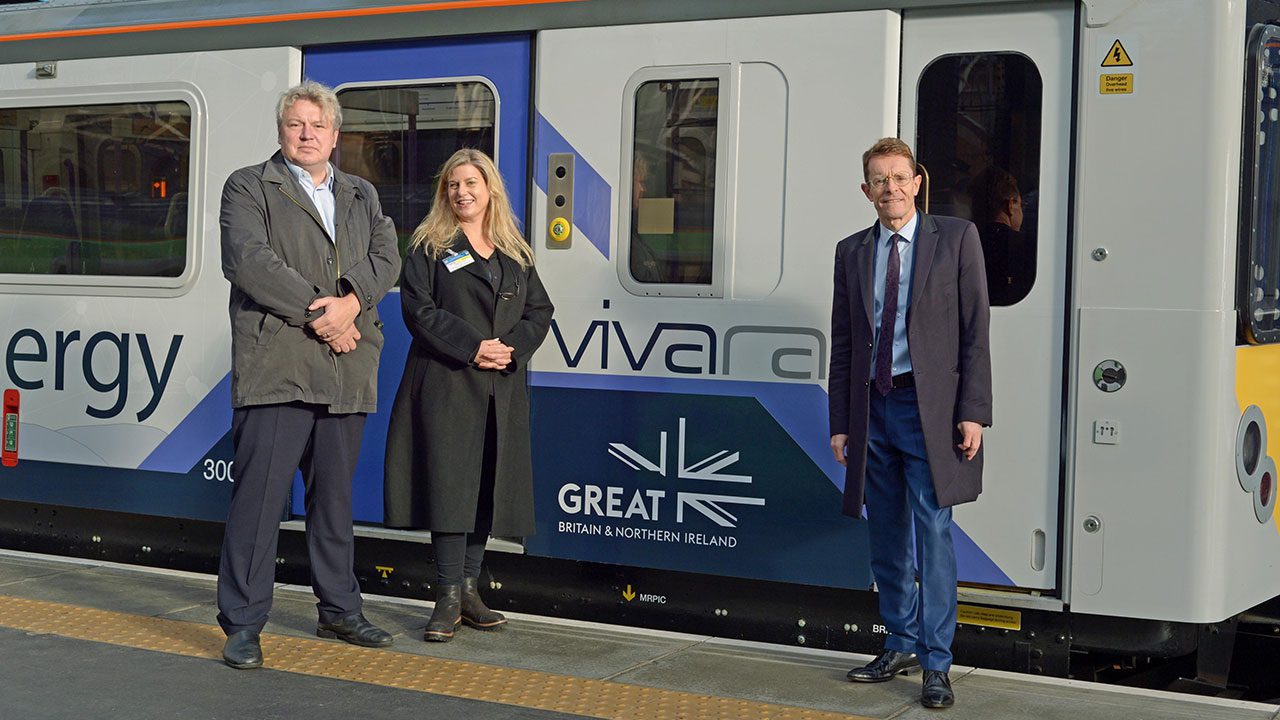 (L-R) Alex Burrows, (Director of Enterprise & Innovation at the Birmingham Centre for Railway Research and Education), Andy Street (Mayor of the West Midlands and chair of the WMCA) and Alice Gillman (Head of Marketing at Vivarail) meet in front of Vivarail’s next generation battery train.