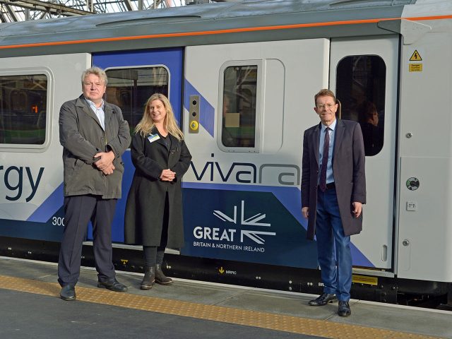 (L-R) Alex Burrows, (Director of Enterprise & Innovation at the Birmingham Centre for Railway Research and Education), Andy Street (Mayor of the West Midlands and chair of the WMCA) and Alice Gillman (Head of Marketing at Vivarail) meet in front of Vivarail’s next generation battery train.