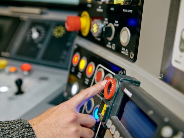 Buttons inside a train simulator.