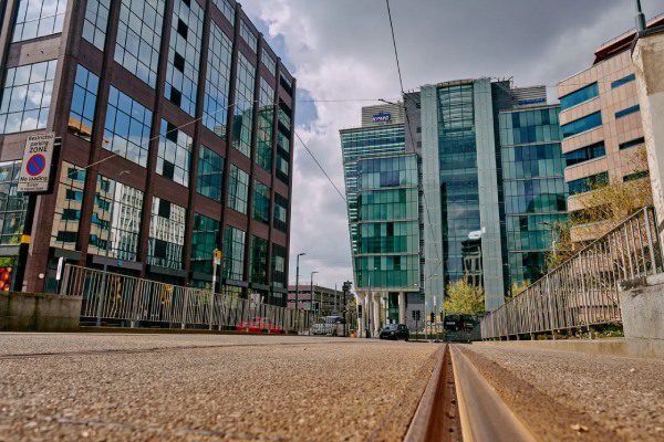 KPMG logo on offices at Snow Hill. The photo was taken close to the ground, next to tram tracks.