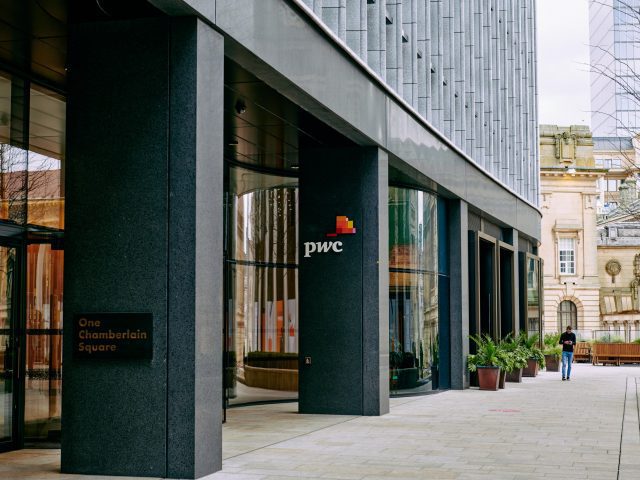 Entrance to One Chamberlain Square, Paradise Birmingham. The PricewaterhouseCoopers (PwC) logo is visible on a column.