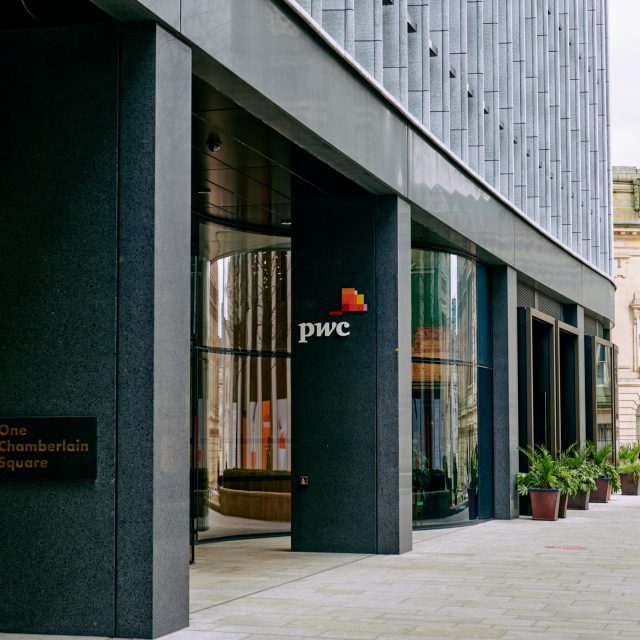 Entrance to One Chamberlain Square, Paradise Birmingham. The PricewaterhouseCoopers (PwC) logo is visible on a column.