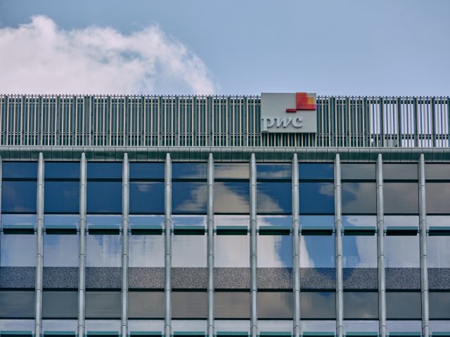 PricewaterhouseCoopers (PwC) logo on top of One Chamberlain Square, Paradise Birmingham.