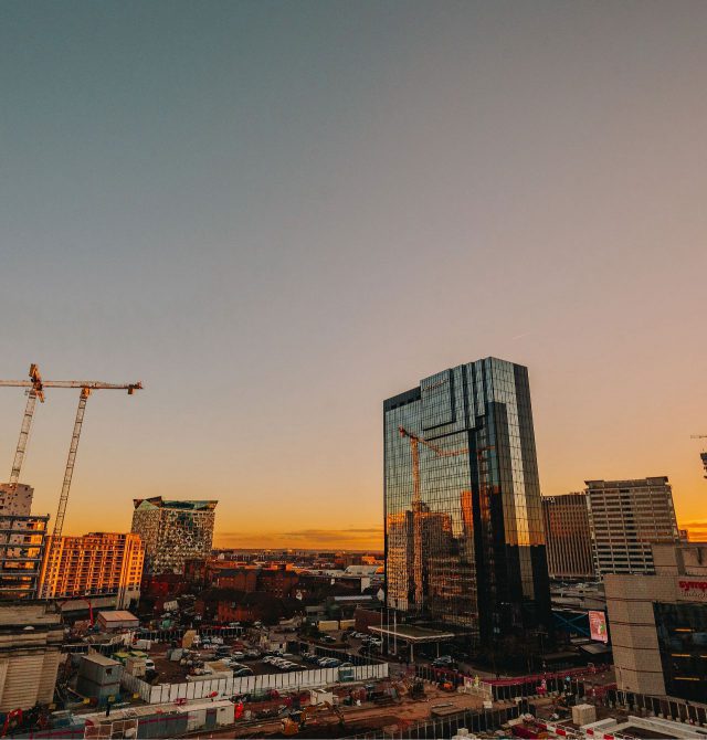 Birmingham skyline looking across Arena Central development and The Cube with the sun setting in the background.