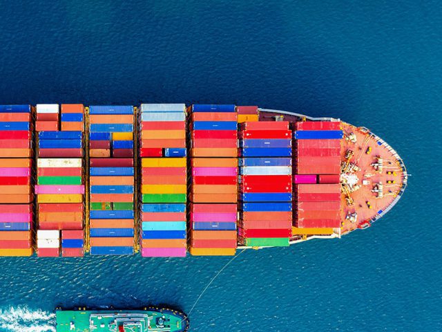 Container ship sailing. From above.