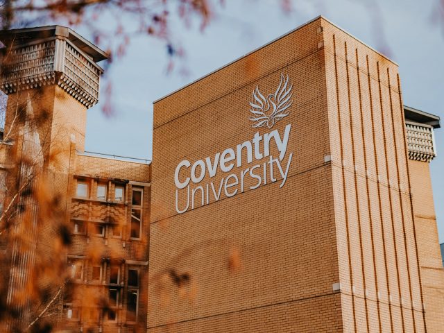 Coventry University logo on the side of a building.