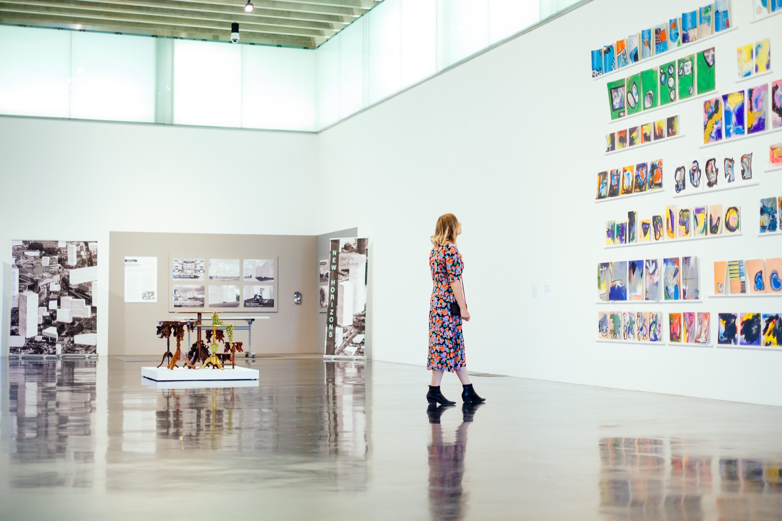 Woman looking at art in a gallery.